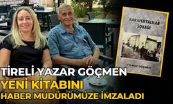 Tireli yazar Göçmen Yeni kitabını haber müdürümüze imzaladı