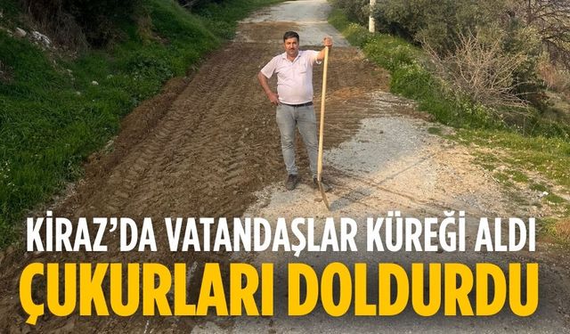 KİRAZ’DA VATANDAŞLAR KÜREĞİ ALDI ÇUKURLARI DOLDURDU
